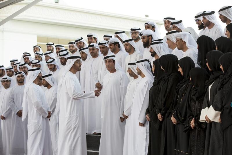 Sheikh Mohammed bin Zayed, Crown Prince of Abu Dhabi and Deputy Supreme Commander of the Armed Forces, speaks to a delegation from the Abu Dhabi section of the 2015 National Election Committee, during a Sea Palace barza. Seen with Sheikh Hamdan bin Zayed, Ruler’s Representative in the Western Region of Abu Dhabi, and Jaber Al Suwaidi, General Director of the Crown Prince Court - Abu Dhabi. Ryan Carter / Crown Prince Court - Abu Dhabi 