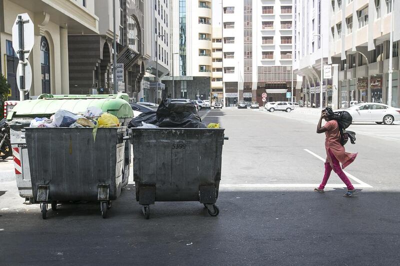 Residents are concerned rubbish containers dumped on roads are creating a traffic hazard. Mona Al Marzooqi / The National