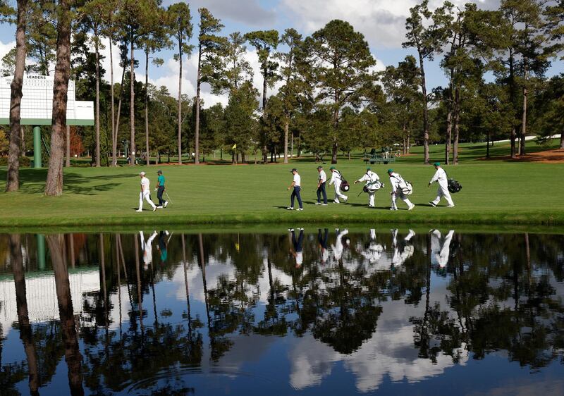 Bryson DeChambeau., Tiger Woods, Justin Thomas and Fred Couples on the 16th fairway during a practice round. Reuters