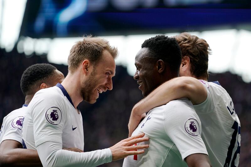 Tottenham's Victor Wanyama, centre right, celebrates with teammate Christian Eriksen after scoring against Huddersfield. EPA