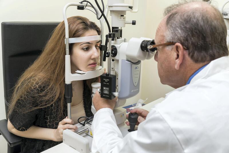 DUBAI, UNITED ARAB EMIRATES. 22 October 2017. Dr. Jeffrey Weiss who is studying bone marrow fraction therapy (autologous stem cells injected into the eye) to restore vision for people who have no other treatment options. He has treated more than 500 people in the US and is now treating patients in Dubai. Dr Weiss is examining Dana Nashawati (Syria) who suffers from Optic Nerve Atrophy. (Photo: Antonie Robertson/The National) Journalist: Jenny Anil. Section: National..