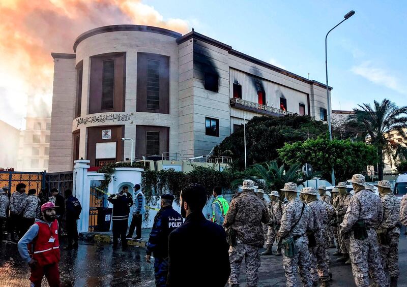 Paramedics and security officers at the scene of an attack outside the Libyan foreign ministry headquarters in the capital Tripoli.  AFP