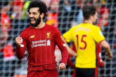 epa08070886 Liverpool's Mohamed Salah celebrates scoring the first goal during the English Premier League soccer match between Liverpool and Watford held at the Anfield in Wolverhampton, Britain, 14 December 2019. EPA/PETER POWELL EDITORIAL USE ONLY. No use with unauthorized audio, video, data, fixture lists, club/league logos or 'live' services. Online in-match use limited to 120 images, no video emulation. No use in betting, games or single club/league/player publications