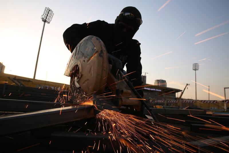A worker helps to prepare Erbil international Stadium, also known as the Franso Hariri Stadium, for the visit of Pope Francis to the capital of the Kurdistan region in Iraq. EPA