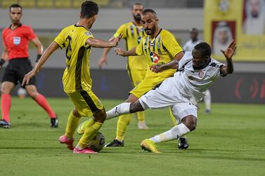Al Jazira’s Oumar Traore, right, challenges Kalba players for the ball during the first leg of their Arabian Gulf Cup encounter at the Ittihad Kalba Stadium. Courtesy Pro League Committee