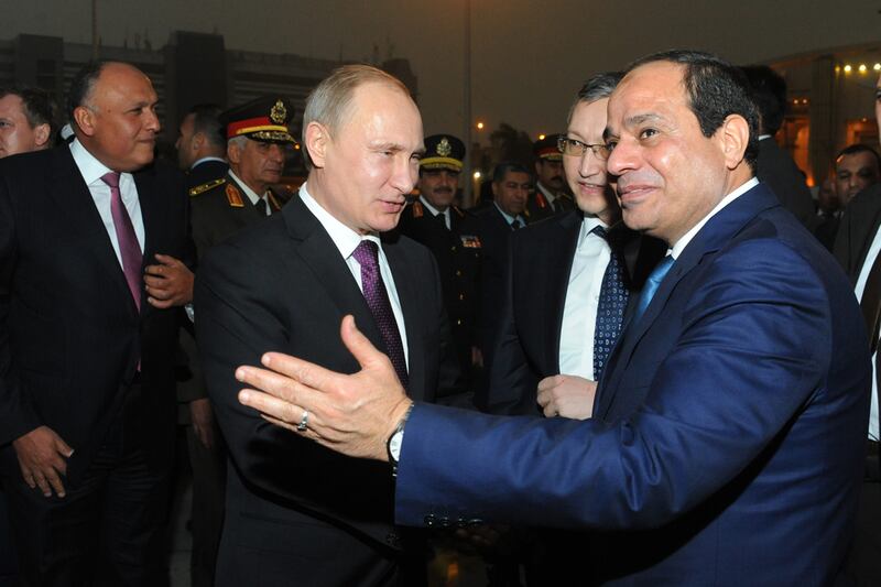 Egyptian President Abdel-Fattah el-Sissi bids farewell to Russian President Vladimir Putin, at Cairo International Airport on February 10, 2015. AP 