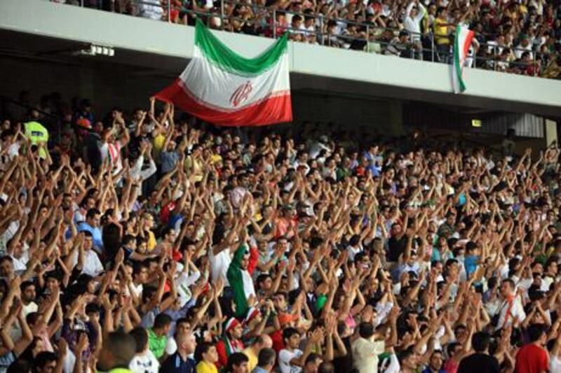07OCT2010-ABU DHABI - Supporters of Iran team cheer up their team  during a friendly match against Brazil yesterday at Zayed sports city in Abu Dhabi. Ravindranath.K / The National 