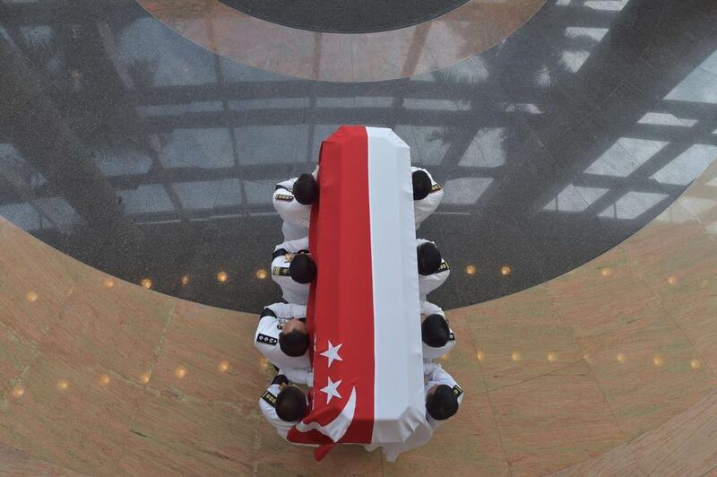 Honour guards carry the coffin bearing Singapore's former prime minister Lee Kuan Yew during his funeral in Singapore on March 29, 2015. Adek Berry/AFP Photo