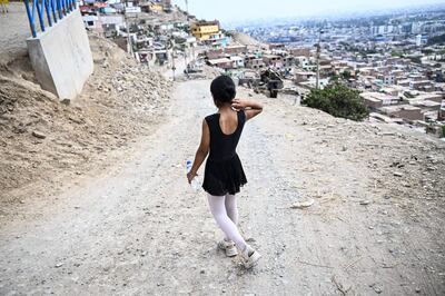 Ballet student Keith Chavez walks home after training at the dance school in San Genaro, in the south of Lima. AFP