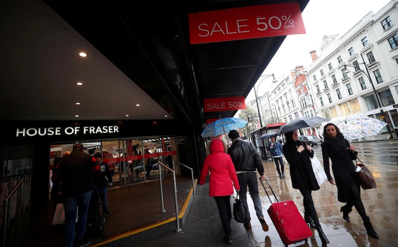 FILE PHOTO: Shoppers walk past House of Fraser on Oxford Street in central London, Britain, April 2, 2018. REUTERS/Hannah McKay//File Photo