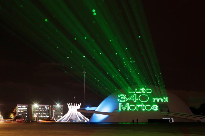 A projection on the walls of Brasilia's national museum with the message 'mourning 340,000 dead' during a protest in Brazil calling for Covid-19 vaccines and in memory of those killed by the disease. Reuters