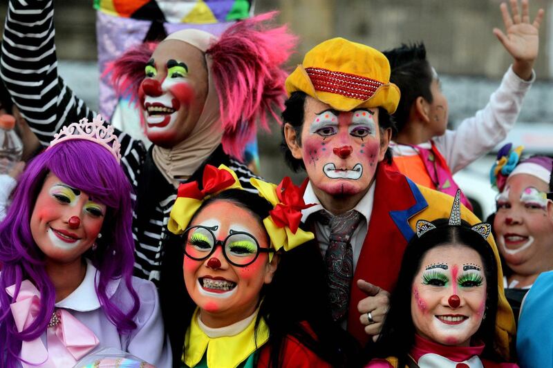 Clowns pose for the camera. AFP