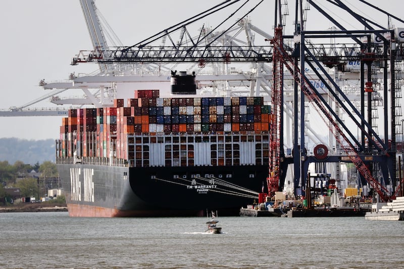 A cargo ship sits in a New Jersey port along New York Harbour. Policies to reduce port delays include improving clearance processes and adopting digital technologies, the World Bank says. AP