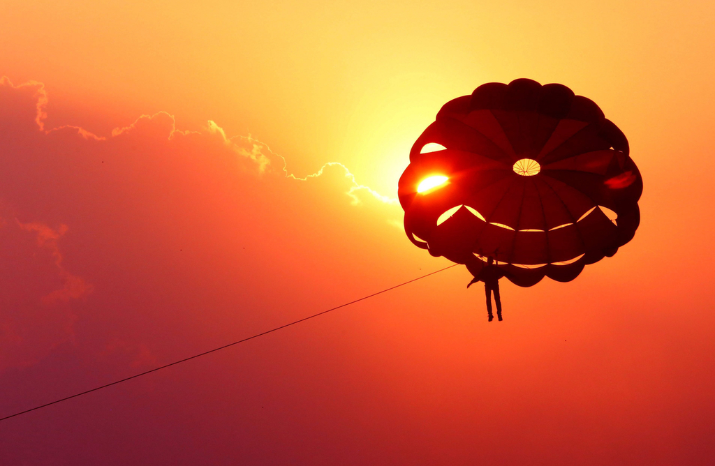 Parasailing offers a birds-eye view of Fujairah's dramatic landscapes. EPA