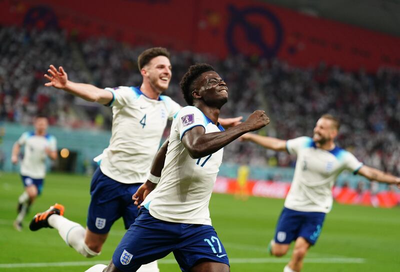 England's Bukayo Saka celebrates scoring. PA