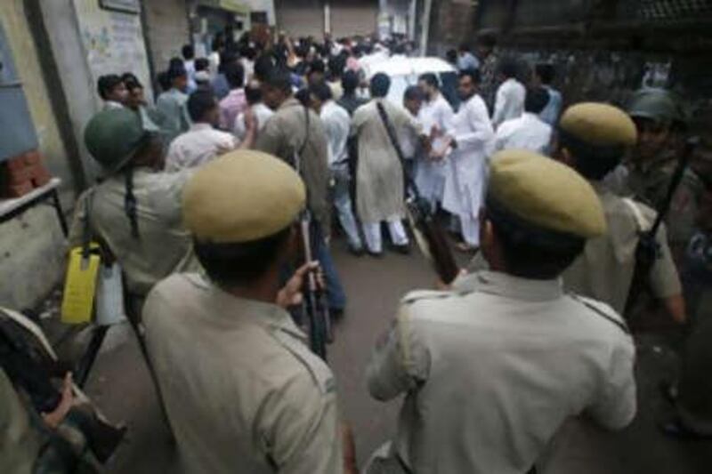 Policemen secure the site of a raid on suspected militants in New Delhi on Sept 19 2008.