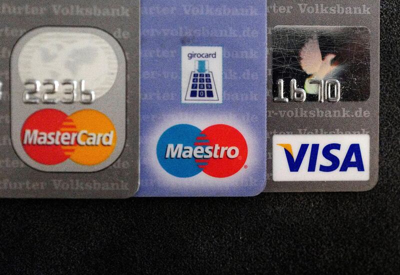 FILE PHOTO: Bank debit and credit cards are photographed in this illustration picture at an office in Frankfurt, Germany, March 17, 2016.    REUTERS/Kai Pfaffenbach/File Photo