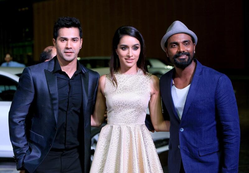 Remo D’Souza dancer, choreographer, actor and film director, with actress Shraddha Kapoor and actor Varun Dhawan on the golden carpe. Ravindranath K / The National