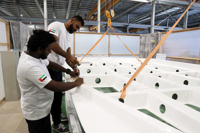 Sunreef workers preparing the roof of a boat. The plan is for the company's mid-range catamarans to be constructed in the UAE. Pawan Singh / The National