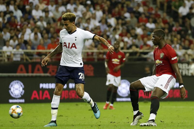 SHANGHAI, CHINA - JULY 25: Dele Alli of Tottenham Hotspur and Paul Pogba of Manchester United compete for the ball during the International Champions Cup match between Tottenham Hotspur and Manchester United at the Shanghai Hongkou Stadium on July 25, 2019 in Shanghai, China. (Photo by Fred Lee/Getty Images )