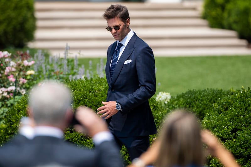 Different lawns. Brady arrives for US President Joe Biden's ceremony to honour the Super Bowl LV champions Tampa Bay Buccaneers on the South Portico of the White House in Washington, DC, on July 20, 2021. EPA