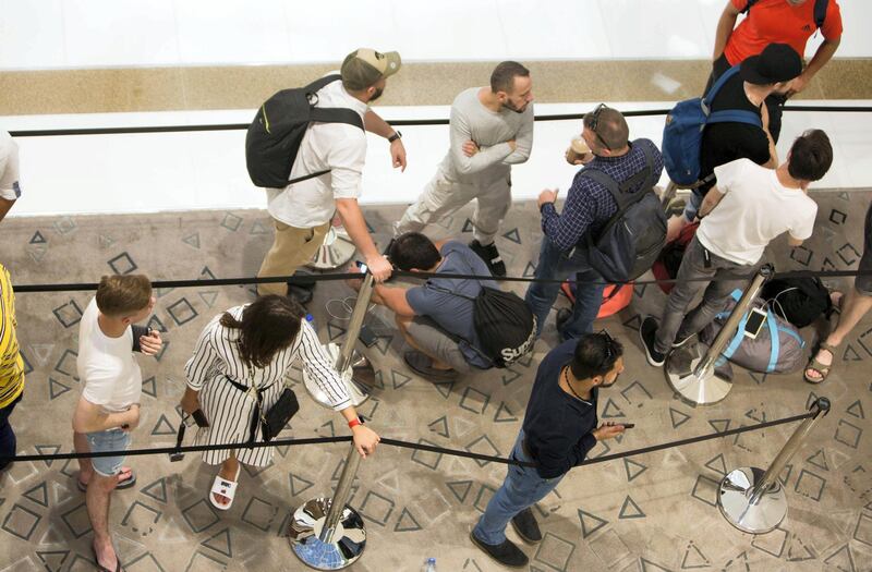 DUBAI, UNITED ARAB EMIRATES, 20 SEPTEMBER 2018 - Crowd waiting in queue to get the new iphone XS at Apple store in Dubai Mall.  Leslie Pableo for The National for Patrick Ryan’s story