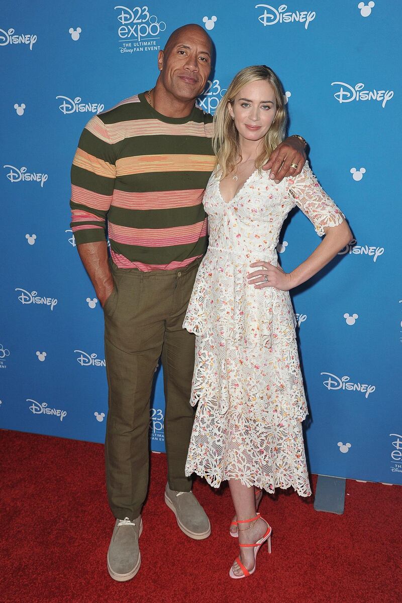 Dwayne 'The Rock' Johnson and Emily Blunt attend the Go Behind the Scenes with the Walt Disney Studios press line at the 2019 D23 Expo. AP.