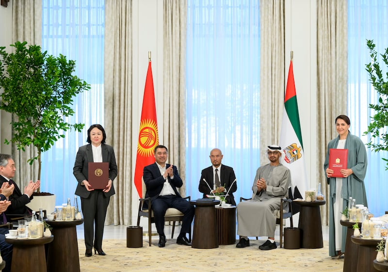 Mariam Al Mheiri, UAE Minister of Climate Change and Environment, and Dinara Kutmanova, Minister of Natural Resources, Ecology and Technical Supervision of Kyrgyzstan, exchange agreements.