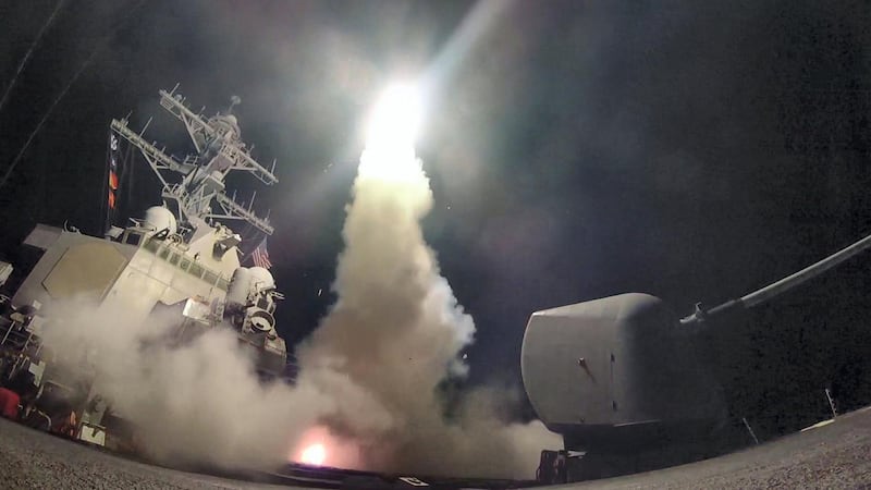In this image released by the US Navy, the guided-missile destroyer USS Porter conducts strike operations while in the Mediterranean Sea, April 7, 2017.   
US President Donald Trump ordered a massive military strike on a Syrian air base on Thursday in retaliation for a "barbaric" chemical attack he blamed on President Bashar al-Assad. The missiles were fired from the USS Porter and the USS Ross, which belong to the US Navy's Sixth Fleet and are located in the eastern Mediterranean. / AFP PHOTO / US NAVY / Ford WILLIAMS / RESTRICTED TO EDITORIAL USE - MANDATORY CREDIT "AFP PHOTO / US NAVY / Mass Communication Specialist 3rd Class Ford Williams" - NO MARKETING NO ADVERTISING CAMPAIGNS - DISTRIBUTED AS A SERVICE TO CLIENTS


