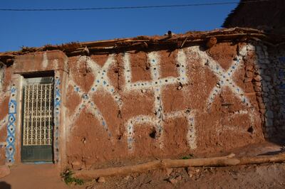 Amazigh wall drawings in a traditional Berber village. Rosemary Behan