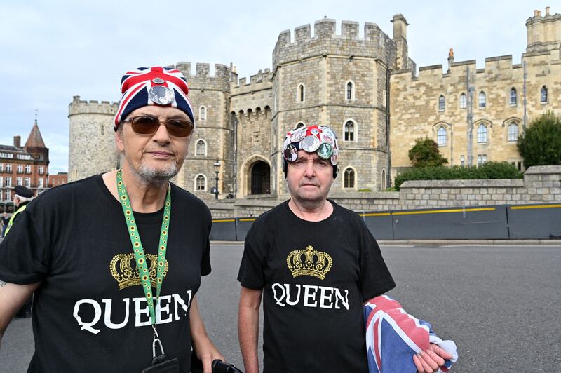 Royal enthusiasts Sky London and John Lowry outside Windsor Castle on Thursday. AFP