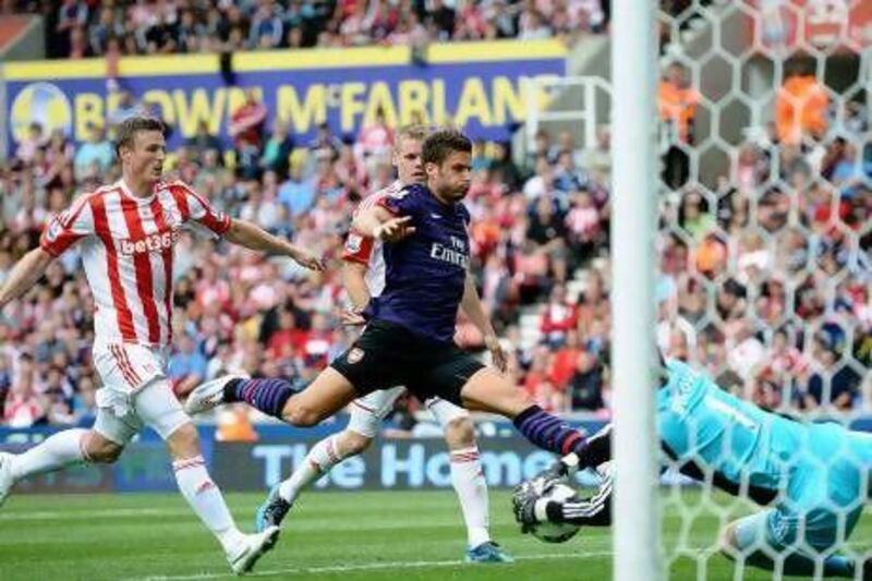 STOKE ON TRENT, ENGLAND - AUGUST 26: Oliver Giroud of Arsenal see's his shot saved by Asmir Begovic of Stoke during the Barclays Premier League match between Stoke City and Arsenal at The Britannia Stadium on August 26, 2012 in Stoke on Trent, England. (Photo by Laurence Griffiths/Getty Images) *** Local Caption *** 150794702.jpg