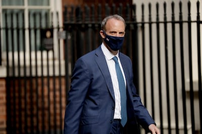 Britain's Foreign Secretary Dominic Raab walks into Downing Street in London, Tuesday, April 27, 2021. (AP Photo/Matt Dunham)