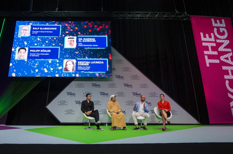 Philipp Rosler, former vice chancellor of Germany; Dr Narwan Al Zahrouni, chief executive of the Dubai Blockchain Centre; Ralf Glabischnig, founder and board member of CV Labs; and Kristina Lucrezia Corner, editor-in-chief of Cointelegraph, at Gitex Global in Dubai on Monday. Leslie Pableo / The National