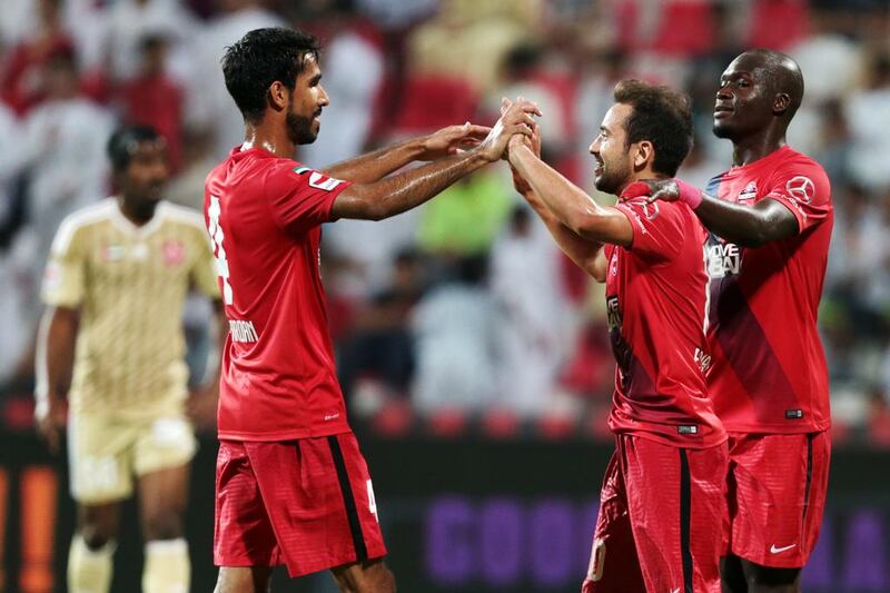 Members of Al Ahli celebrate scoring against Al Shaab during their Arabian Gulf League match, the final one of the season, at Rashid Stadium in Dubai on May 8, 2016. Christopher Pike / The National