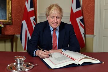 UK Prime Minister Boris Johnson signs the Brexit Withdrawal Agreement.