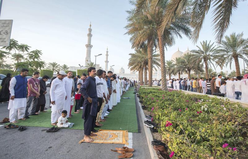 Abu Dhabi, UNITED ARAB EMIRATES - Faithfuls are performing morning prayers on the first day of Eid-Al Fitr at the Sheikh Zayed Grand Mosque.  Leslie Pableo for The National