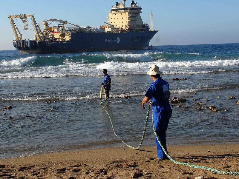 Workers drag an undersea fibre optic cable in Cuba. About 380 undersea cables form the backbone of the global internet. EPA