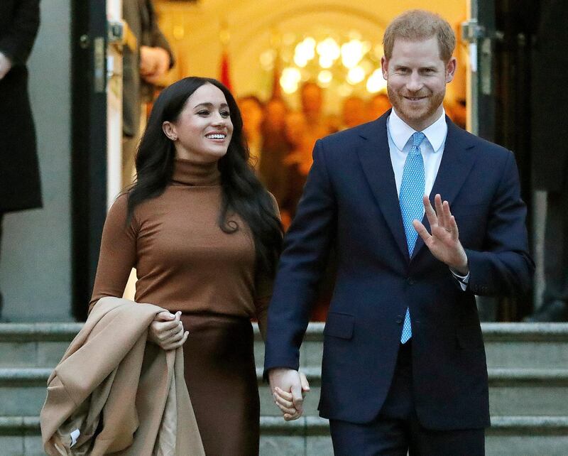 FILE - Prince Harry and Meghan, the Duke and Duchess of Sussex, leave after visiting Canada House on Jan. 7, 2020, in London. Harry and Meghan stepped away from full-time royal life in early 2020, and Buckingham Palace on Friday Feb. 19, 2021, confirmed the couple will not be returning to royal duties, and Harry will give up his honorary military titles. (AP Photo/Frank Augstein, File)