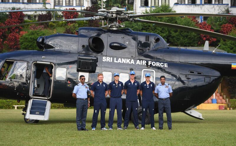 England players, left to right, Jonny Bairstow, Joe Root, Keaton Jennings and Olly Stone pictured with the crew of the military helicopter before flying to the England cricket team's visit to a de-mining event held by MAG in Periyamadu. Getty Images