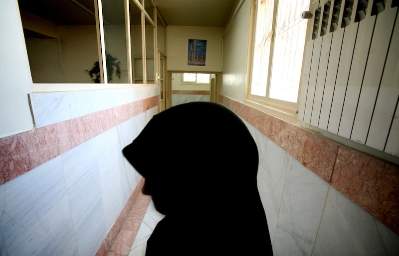 A female prison guard stands along a corridor in Tehran's Evin prison in 2006. Reuters