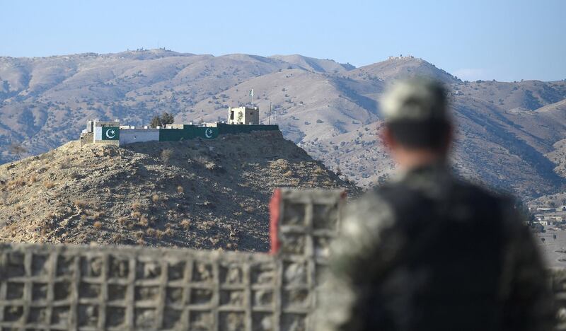 A Pakistani army soldier stands guard on a border terminal in Ghulam Khan, a town in North Waziristan, on the border between Pakistan and Afghanistan, on January 27, 2019. - Afghans harboured furtive hopes on January 27 that talks between the US and Taliban leaders could end decades of conflict, despite fears an American withdrawal might unleash even more violence. American negotiators and the Taliban on January 26 said the two sides had made substantial progress in the most recent round of talks in Qatar, promising to meet again to continue discussions that could pave the way for official peace negotiations. (Photo by FAROOQ NAEEM / AFP)