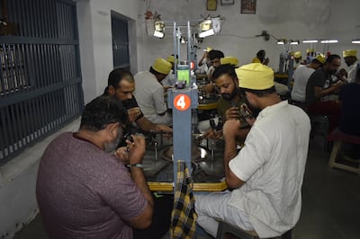 Prisoners work in groups of four at the diamond-polishing workshop at Lajpore Central Jail in Surat, India. Photo: Lajpore Central Jail