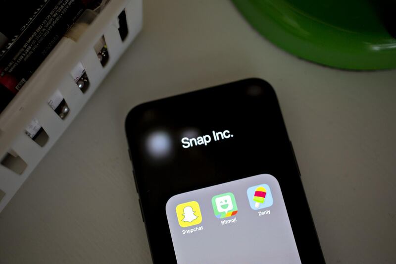 Snap Inc. Snapchat, Bitmoji, and Zenly application icons are displayed on an Apple Inc. iPhone in an arranged photograph taken in Tiskilwa, Illinois, U.S., on Monday, Feb. 4, 2019. Snap Inc. is scheduled to release earnings figures on February 5. Photographer: Daniel Acker/Bloomberg