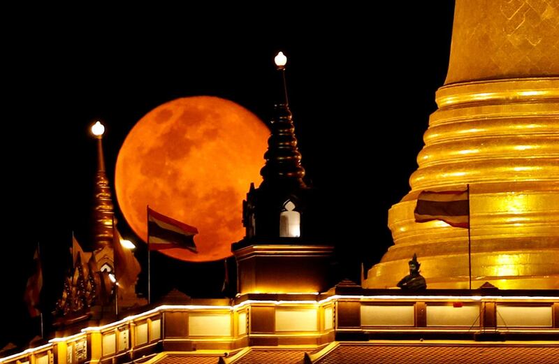 The pink supermoon rises above Wat Saket Temple in Bangkok, Thailand. Reuters