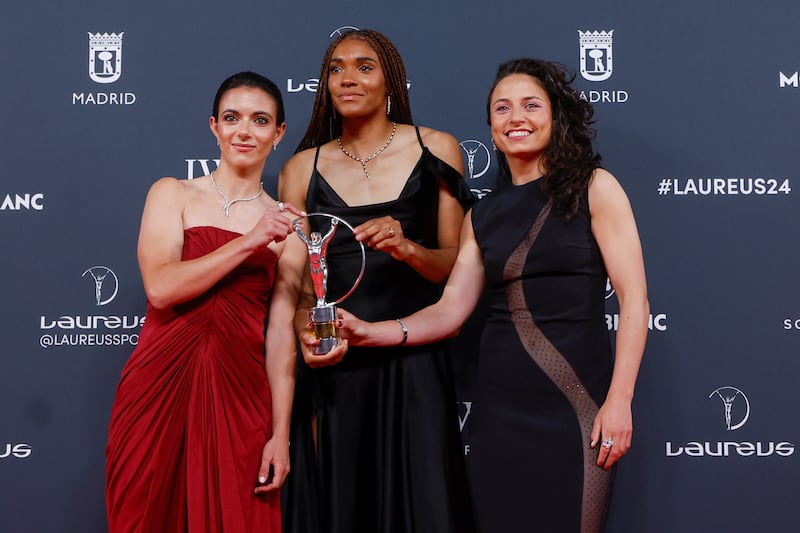 Spain's women's national team players Aitana Bonmati, left, Salma Paralluelo, centre, and Ivana Andres pose for photographers after receiving the 2024 Laureus award for best team. EPA