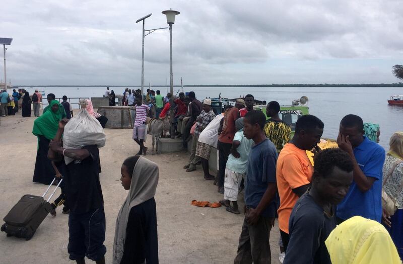 Travellers gather at the Lamu jetty following an attack by Al Shabab militants. Reuters