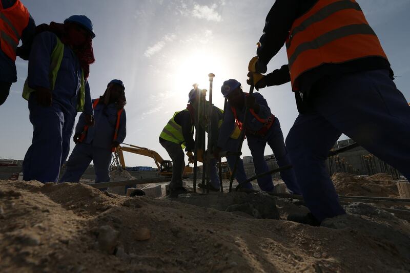 epa06704412 Foreign laborers work at a construction site in Abu Dhabi, United Arab Emirates, 01 May 2018. Labour Day or May Day is observed all over the world on the first day of the month of May to celebrate the economic and social achievements of workers and fight for laborers rights.  EPA/ALI HAIDER