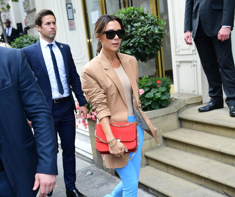 Victoria Beckham leaves after her London Fashion Week SS19 show in London, Sunday Sept. 16, 2018. Beckham has brought her fashion brand home to London Fashion Week for the first time to mark a decade in the business, it was reported on Sunday. (Ian West/PA via AP)