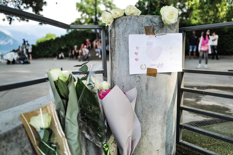 Flowers and messages of support. AFP